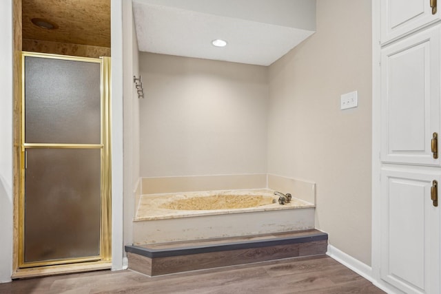 201 Trailwood Dr, Euless, TX 76039 - bathroom featuring hardwood / wood-style flooring and plus walk in shower