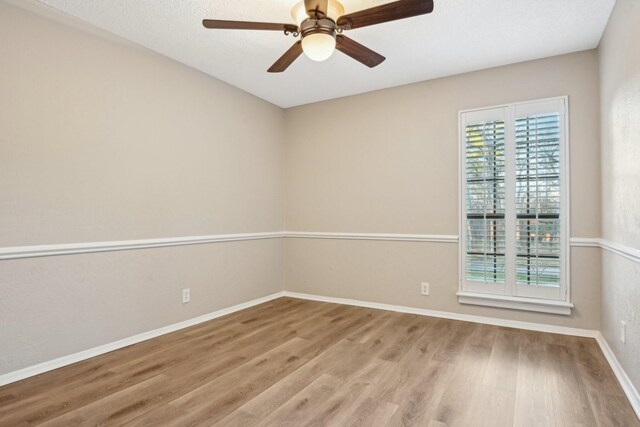 201 Trailwood Dr, Euless, TX 76039 - unfurnished room with light hardwood / wood-style flooring and ceiling fan