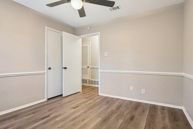 201 Trailwood Dr, Euless, TX 76039 - interior space featuring ceiling fan, a closet, light hardwood / wood-style flooring, and a textured ceiling