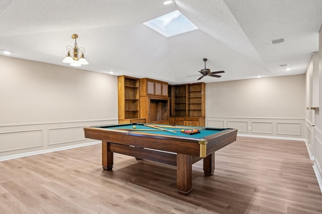 201 Trailwood Dr, Euless, TX 76039 - rec room with billiards, lofted ceiling, wood-type flooring, a textured ceiling, and ceiling fan