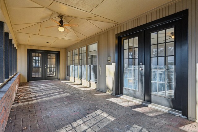 201 Trailwood Dr, Euless, TX 76039 - property entrance featuring french doors, ceiling fan, and a patio area