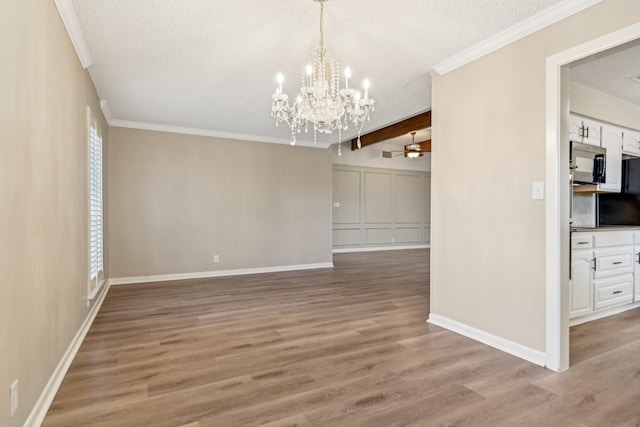 201 Trailwood Dr, Euless, TX 76039 - unfurnished dining area featuring hardwood / wood-style floors, crown molding, a textured ceiling, and ceiling fan