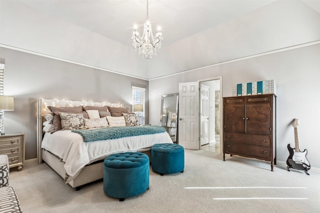 carpeted bedroom with ensuite bathroom, a notable chandelier, and high vaulted ceiling