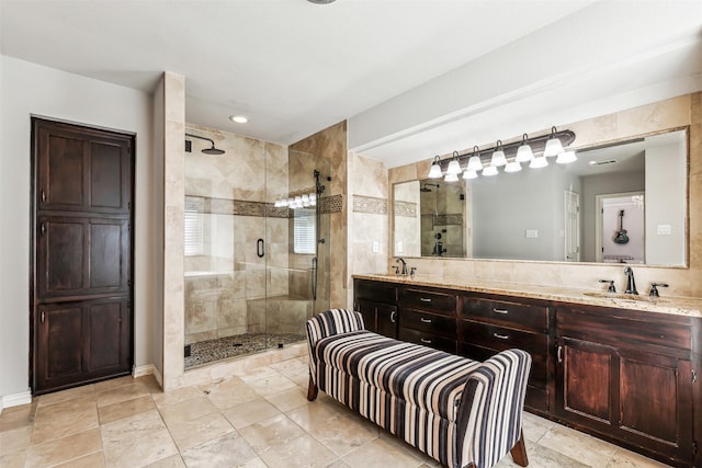 bathroom with vanity and an enclosed shower