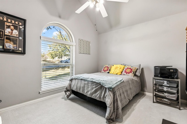 bedroom with vaulted ceiling, ceiling fan, and carpet