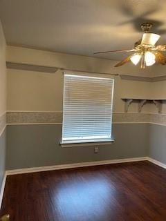 empty room featuring ceiling fan and dark hardwood / wood-style flooring