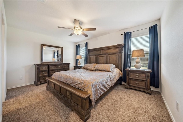 bedroom featuring light colored carpet and ceiling fan