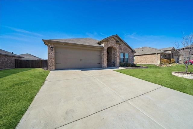 view of front of property featuring a garage and a front yard