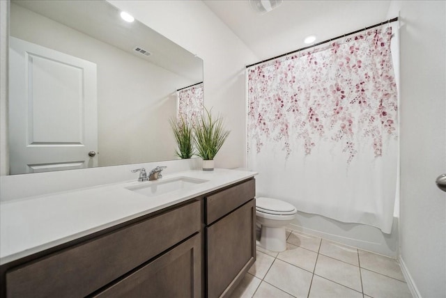 full bathroom with vanity, shower / bath combo, tile patterned floors, and toilet