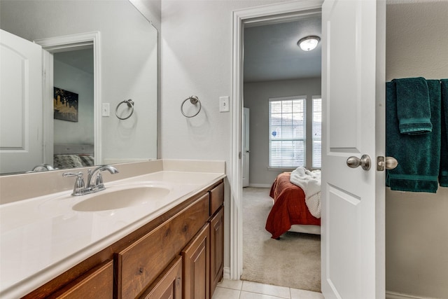 bathroom with tile patterned floors and vanity