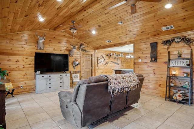 tiled living room featuring lofted ceiling, wood ceiling, ceiling fan, and wood walls