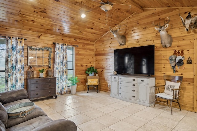 tiled living room featuring vaulted ceiling, wooden ceiling, ceiling fan, and wood walls