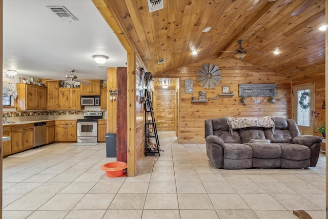 tiled living room featuring wood ceiling, ceiling fan, lofted ceiling, and wooden walls