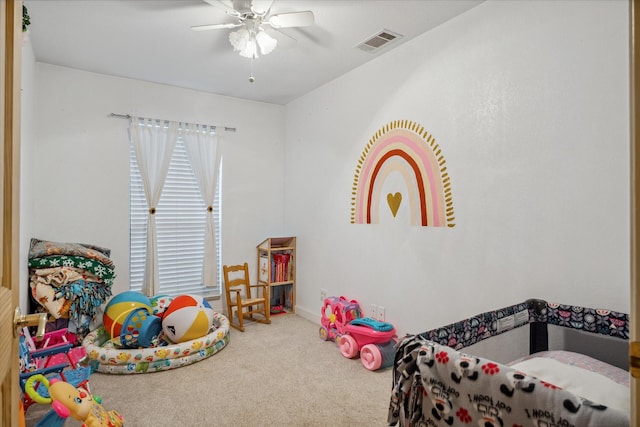 game room with carpet flooring and ceiling fan