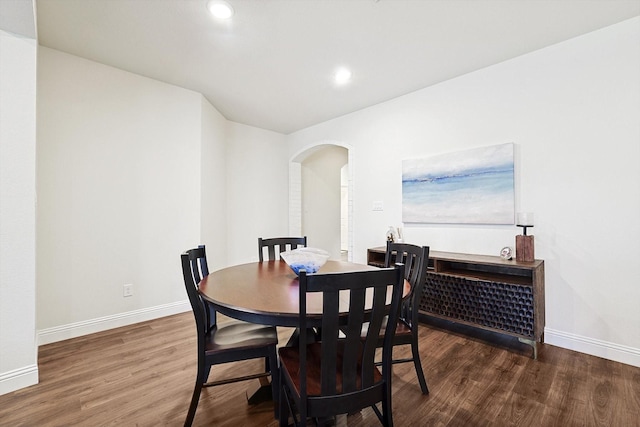 dining room with dark wood-type flooring