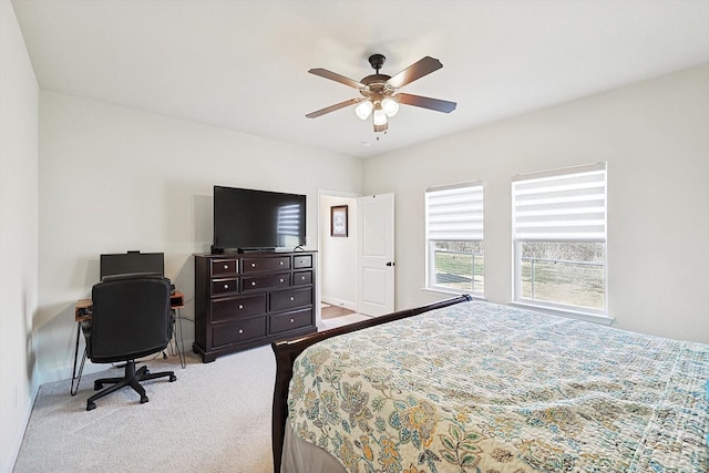 bedroom featuring light colored carpet and ceiling fan