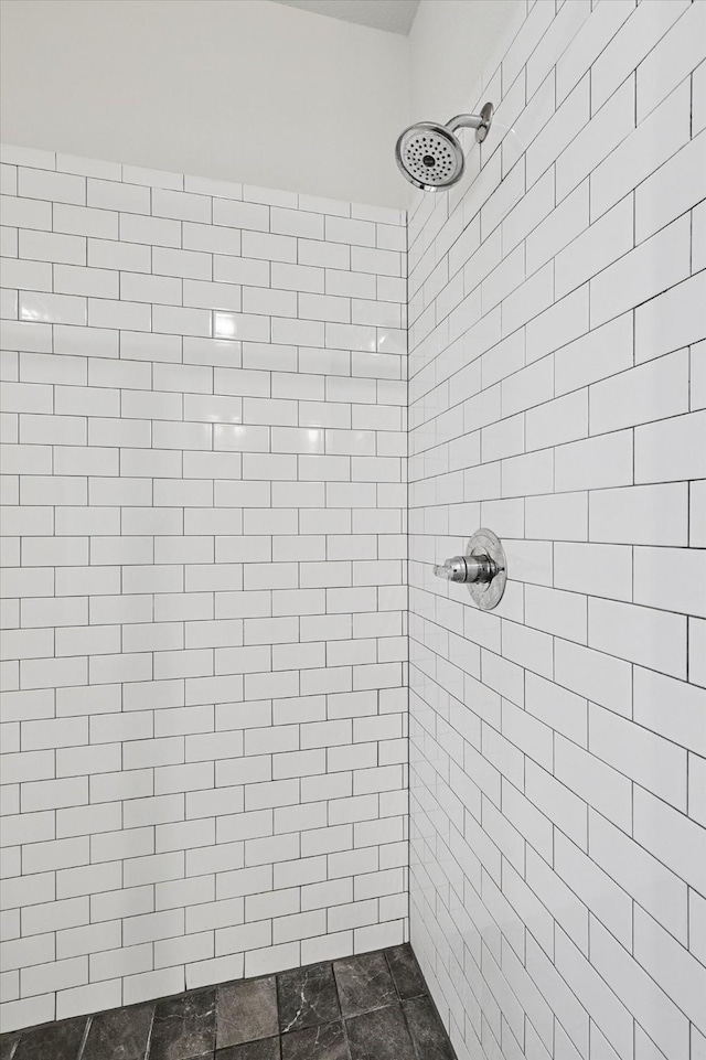 bathroom featuring a tile shower