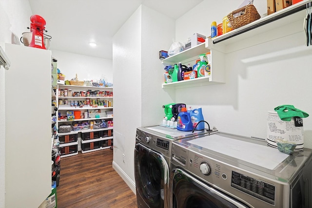 washroom featuring dark wood-type flooring and washer and dryer