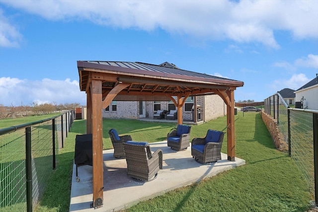 view of community featuring a yard, a patio area, outdoor lounge area, and a gazebo