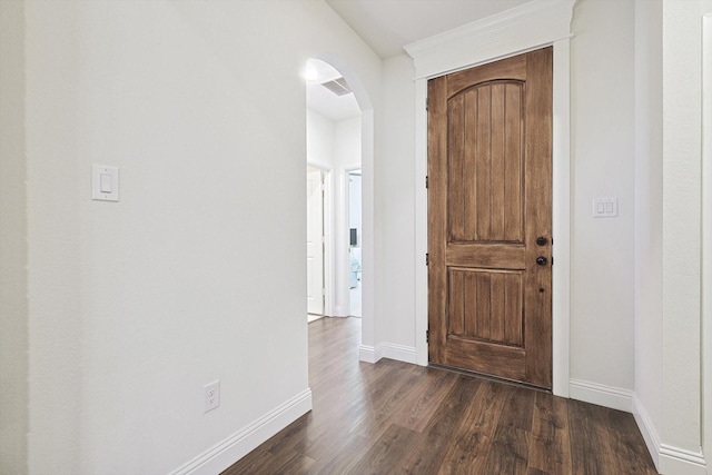 corridor with dark hardwood / wood-style flooring