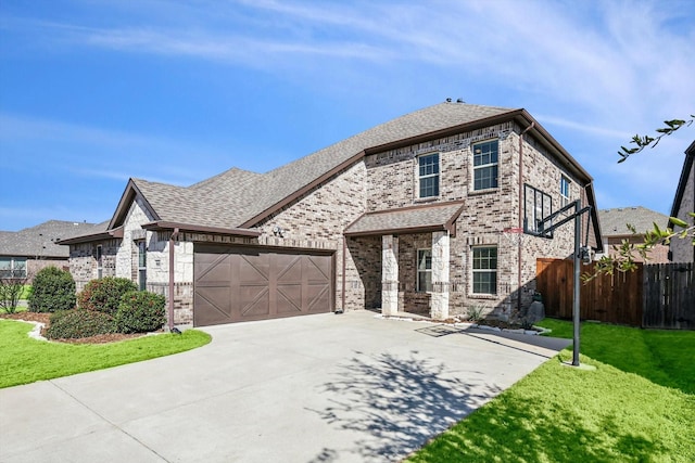 view of front facade with a garage and a front lawn