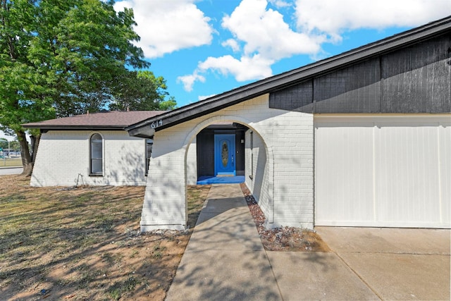 doorway to property featuring a garage