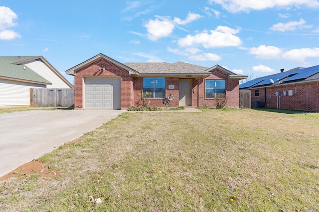 single story home featuring a garage, a front lawn, and central air condition unit