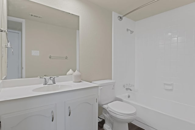 full bathroom featuring vanity, bathing tub / shower combination, and toilet