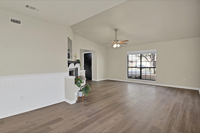 unfurnished living room with ceiling fan, wood-type flooring, and lofted ceiling