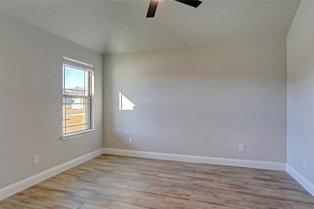 unfurnished room with light wood-style flooring, baseboards, and ceiling fan