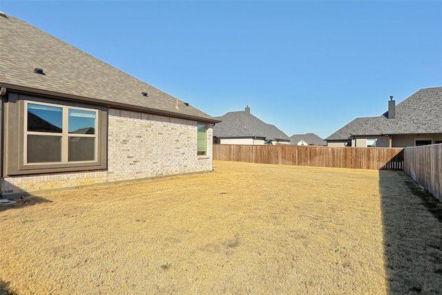 view of yard featuring a fenced backyard