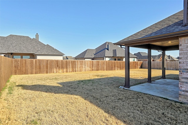 view of yard featuring a fenced backyard and a patio