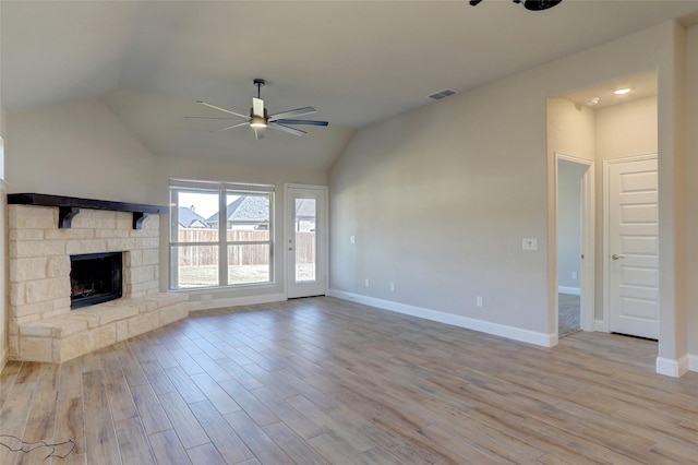 unfurnished living room featuring visible vents, ceiling fan, light wood-style flooring, and a fireplace