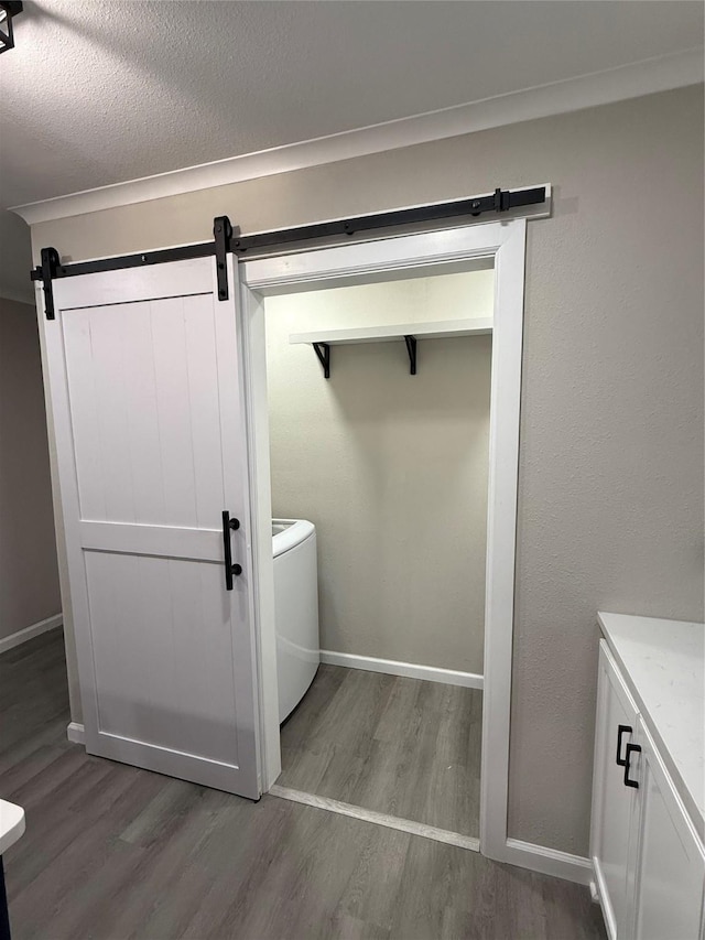 bathroom with vanity, hardwood / wood-style floors, and a textured ceiling