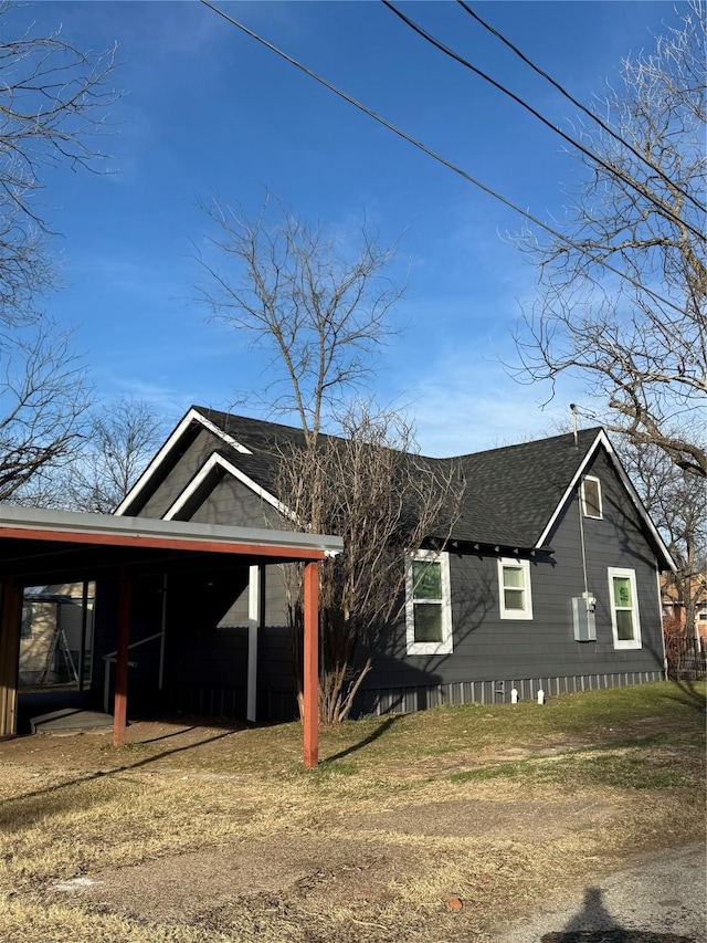 view of side of property with a carport