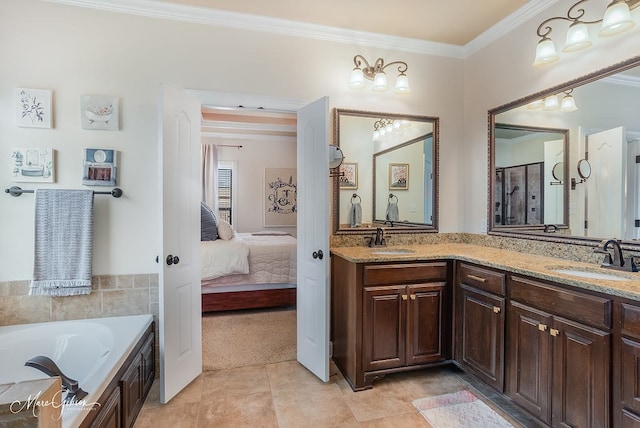 bathroom featuring ornamental molding, a washtub, vanity, and tile patterned floors