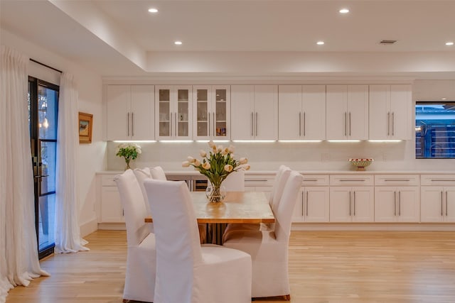 dining area with light hardwood / wood-style floors