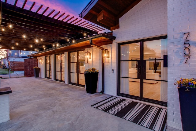 view of patio terrace at dusk