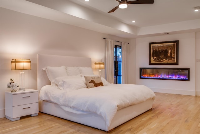 bedroom featuring ceiling fan and light wood-type flooring