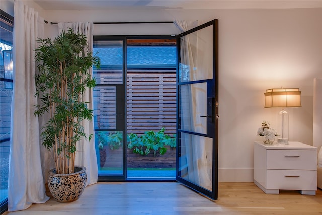 entryway with light hardwood / wood-style flooring