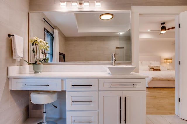 bathroom with vanity and hardwood / wood-style floors