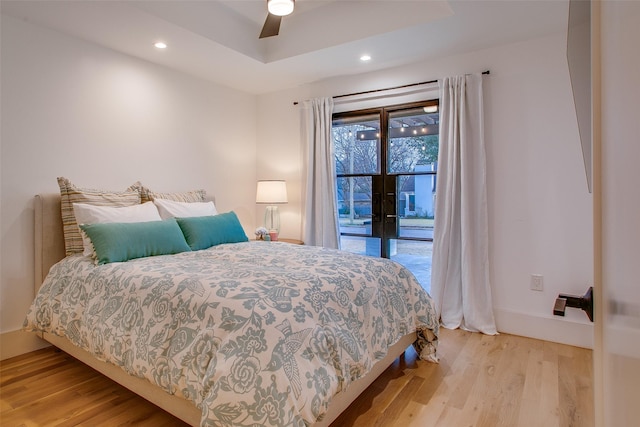 bedroom with ceiling fan and light hardwood / wood-style flooring