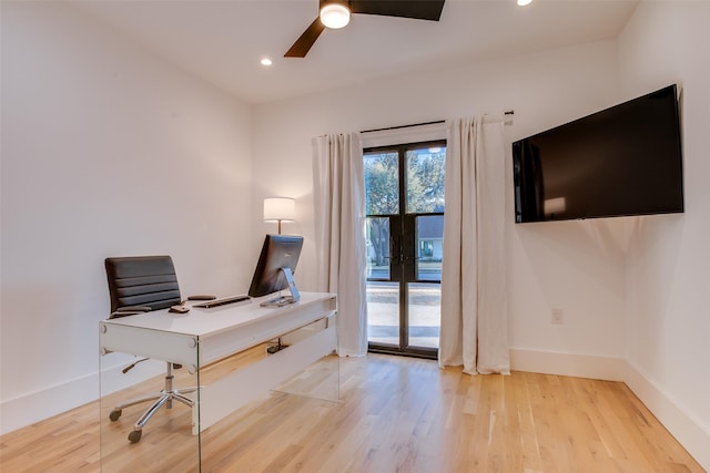 office area with ceiling fan and light hardwood / wood-style flooring