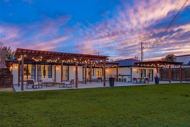 view of home's community featuring a pergola, a patio area, and a lawn