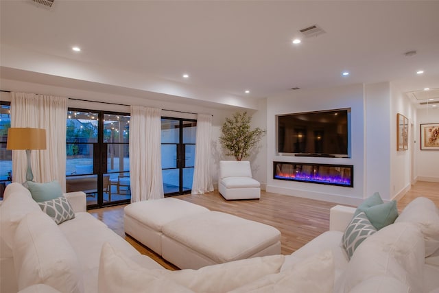 living room with light hardwood / wood-style floors