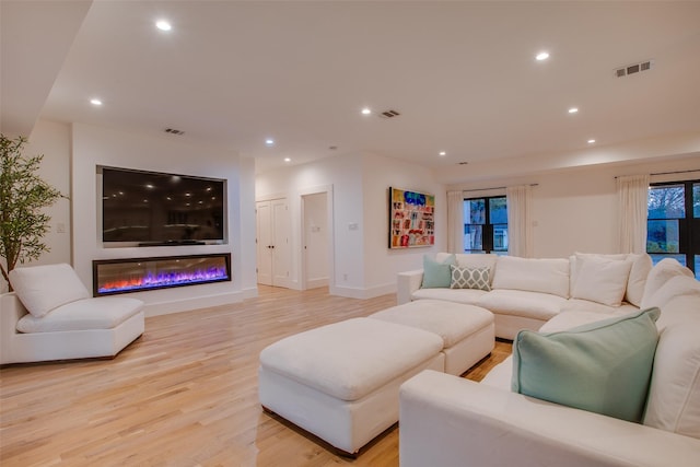 living room with light hardwood / wood-style flooring