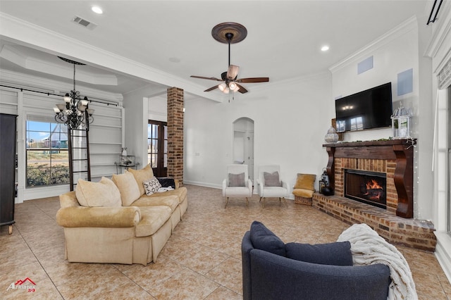 foyer entrance featuring a raised ceiling, ornamental molding, and light tile patterned floors