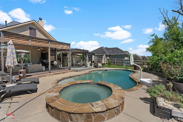 view of pool with a pool with connected hot tub, a patio, outdoor lounge area, and a fenced backyard