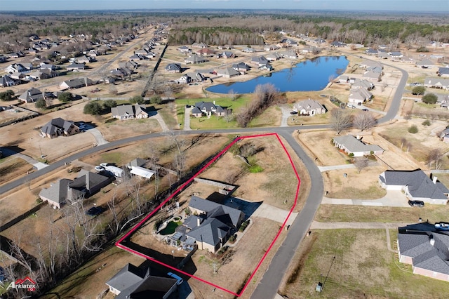 birds eye view of property featuring a water view