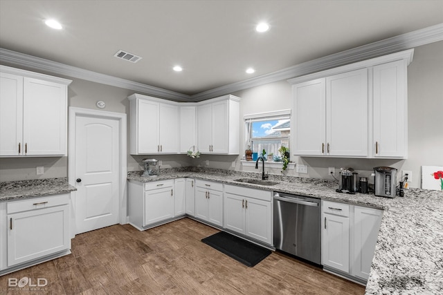 kitchen featuring hardwood / wood-style flooring, dishwasher, white cabinets, and crown molding